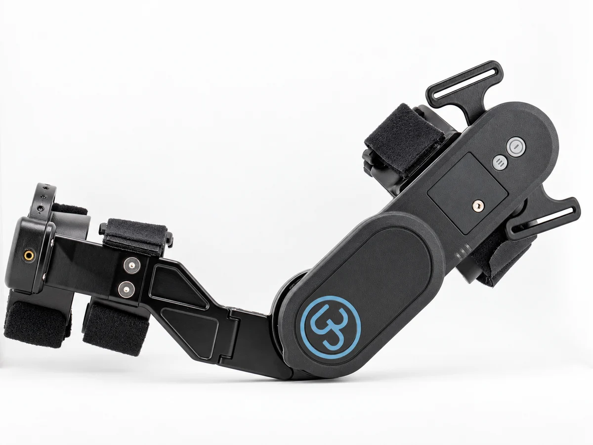 Lateral view of the UbiliFlex arm brace showing cuffs, connecting structure, and powered housing